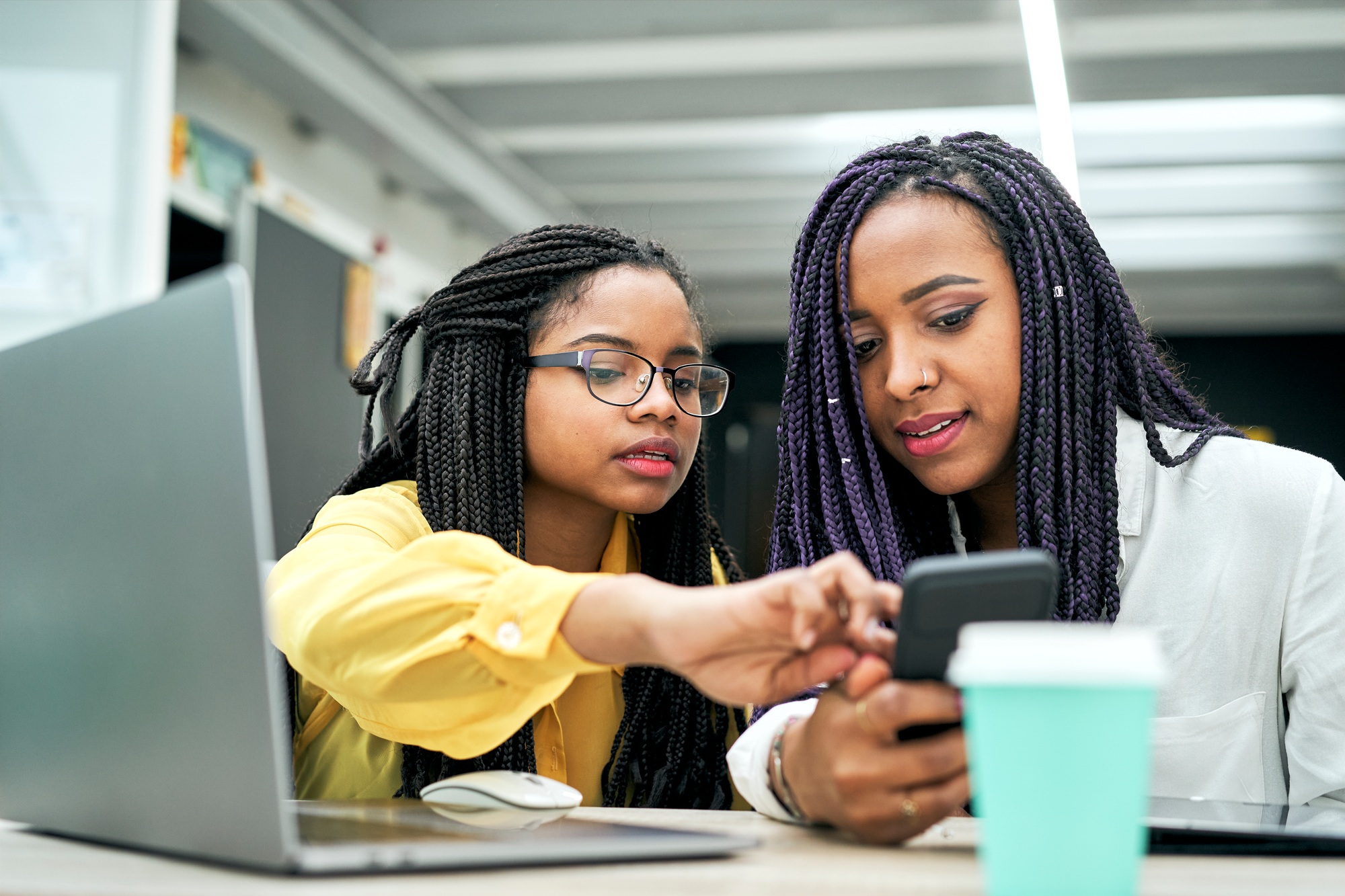 African American coworkers talk about work at office meeting